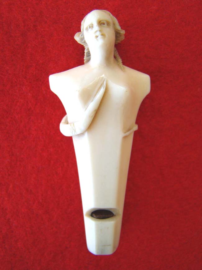 A beautiful carved ivory whistle in the form of a lady circa 1840-1875